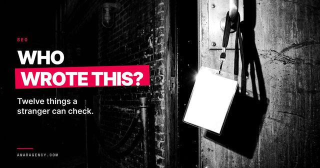 A blank ID badge hanging on a stage door, with the words Who wrote this?
